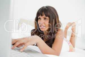 Young woman chatting on a laptop