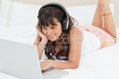 Smiling young woman watching a video