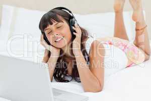 Student in pajama enjoying music