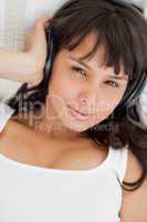 Portrait of a beautiful student listening to music