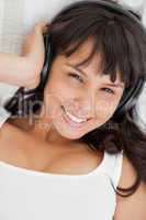 Portrait of a smiling student listening to music