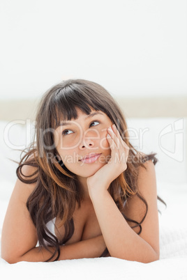 Attractive young woman on her bed