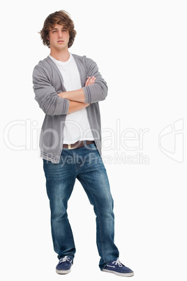 Male student posing with crossed arms