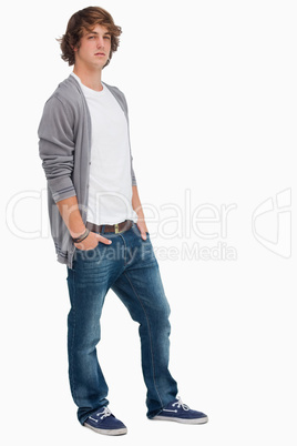 Handsome student posing hands in pockets