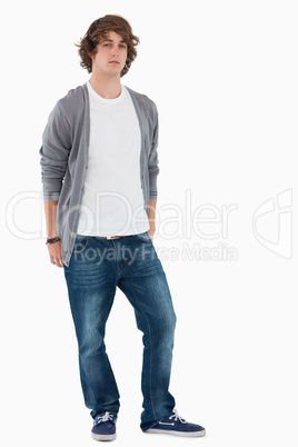 Male student posing hands in the rear pockets