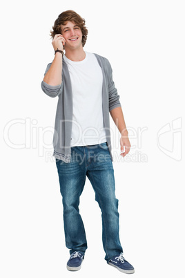 Male student smiling on the phone