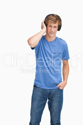 Young blond man wearing headphones