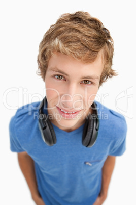 Fisheye view of a blond man with headphones