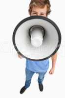 Fisheye view of a male student speaking in a megaphone