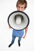 Fisheye view of a megaphone holding by a male student