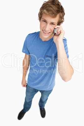 Fisheye view of a male student on the phone