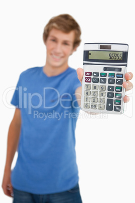 Young man showing a calculator