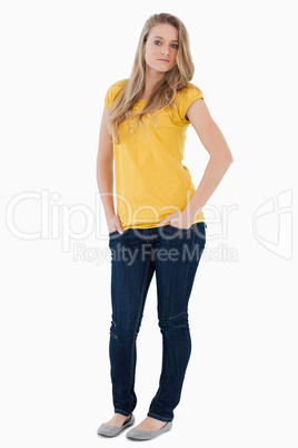Young woman posing hands in the pockets