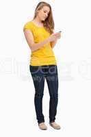 Attractive blonde woman using her cellphone