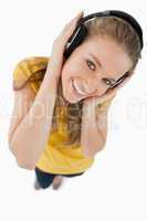Fisheye view of a blonde girl wearing a headphones