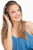 Close-up of a beautiful young woman wearing headphones