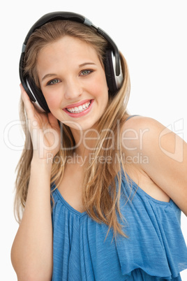 Portrait of a beautiful young woman wearing headphones
