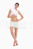 Slim woman holding a towel