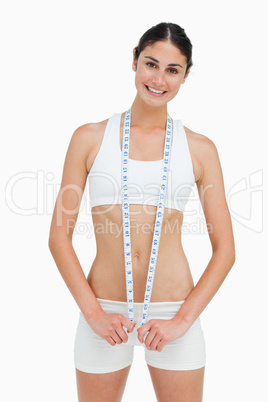 Slim woman with a measure tape