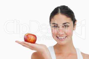 Woman on diet with an apple in the hand