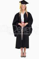 Smiling blonde student in graduate robe