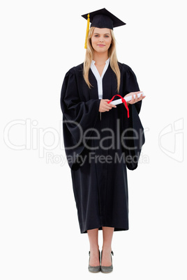 Blonde student in graduate robe holding her diploma