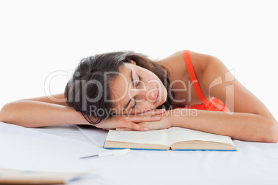 Sleeping student head on her books