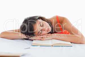 Sleeping student head on her books