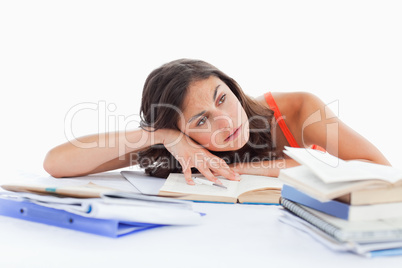 Bored female student doing her homework