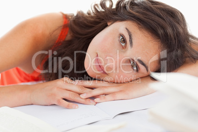 Portrait of a beautiful student head on her homeworks