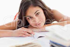 Portrait of a beautiful brunette head on her homeworks