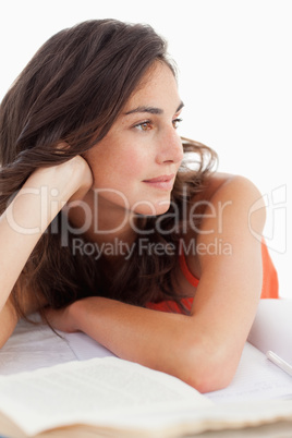 Close-up of a beautiful student at her desk looking away