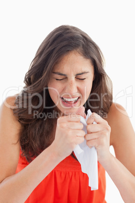 Close-up of a student tearing her homeworks