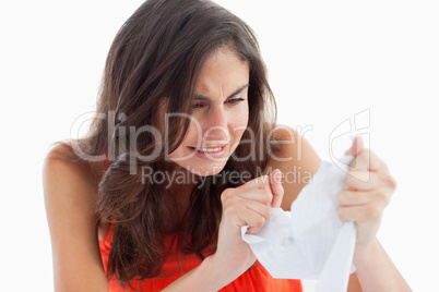 Upset student tearing her homeworks