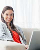 Head and shoulder shot of a smiling woman looking at the camera