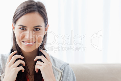 Head and shoulder shot of a woman smiling and looking into the c