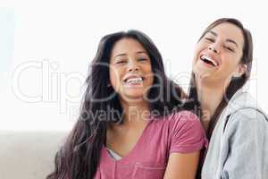 Two laughing women looking towards the camer