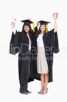 Two women celebrating their graduation