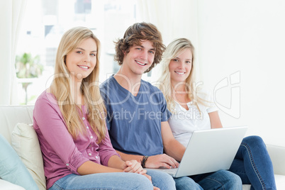 Siblings looking to the camera as they smiles