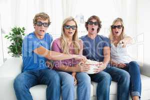 A group of friends watching a scary 3d movie