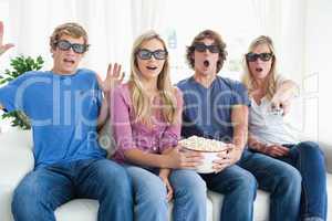 Friends shocked as they watch a scary 3d movie