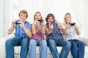 A group of friends playing video games together