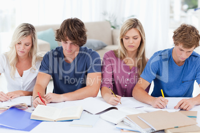 Four students sitting together and studying