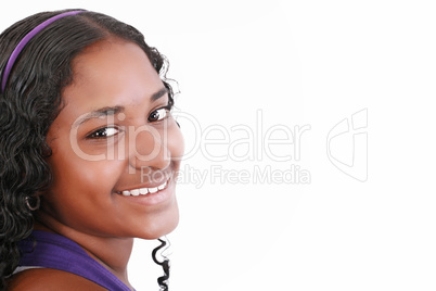 Beautiful smiling face of a happy African teenager girl, isolate