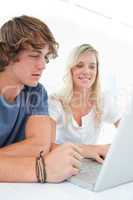 A couple looking at the laptop
