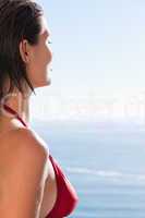 Woman in bikini looking at the sea