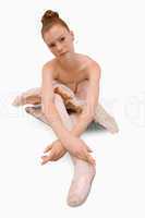 Ballerina sitting on the ground