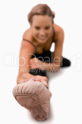 Foot of woman stretching on the floor