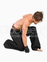 Kneeling martial arts fighter