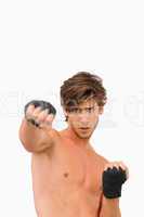 Martial arts fighter in offensive pose